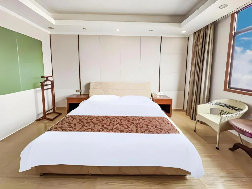 Bed in Jian Guo Grand Hotel