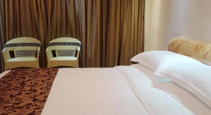 Bed in Jian Guo Grand Hotel