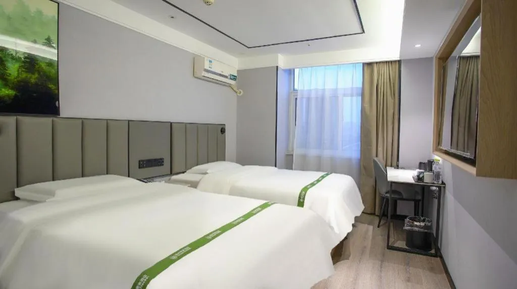 Bed in GreenTree Inn LiaoCheng LinQing HaiShan Building Express Hotel