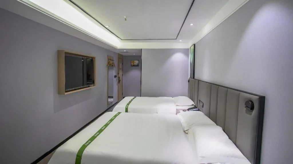 Bed in GreenTree Inn LiaoCheng LinQing HaiShan Building Express Hotel