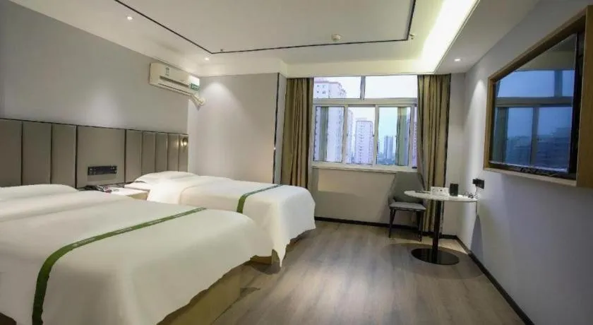 Bed in GreenTree Inn LiaoCheng LinQing HaiShan Building Express Hotel