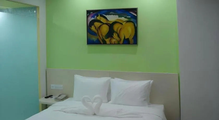 Bed in Gtel Rock City Qingdao Hotel