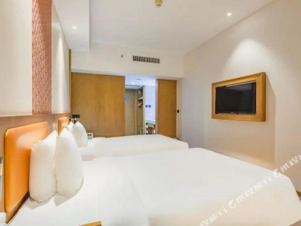 Bed in Gtel Rock City Qingdao Hotel