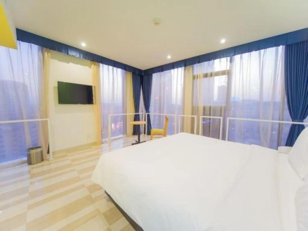 Bed in Gtel Rock City Qingdao Hotel