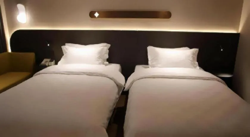 Bed in Jinjiang Inn Henan Museum Hutun Metro Station