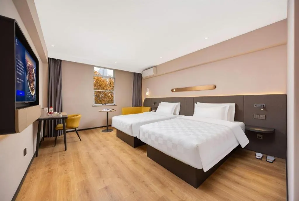 Bed in Jinjiang Inn Henan Museum Hutun Metro Station