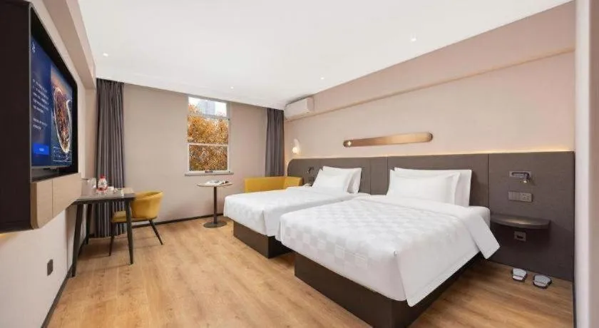 Bed in Jinjiang Inn Henan Museum Hutun Metro Station