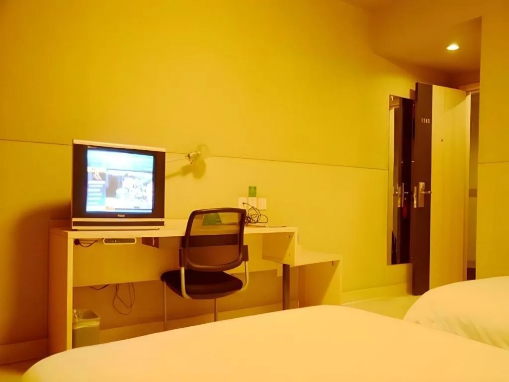 Bed in Jinjiang Inn Changzhou Global Dinosaur City Olympic Center