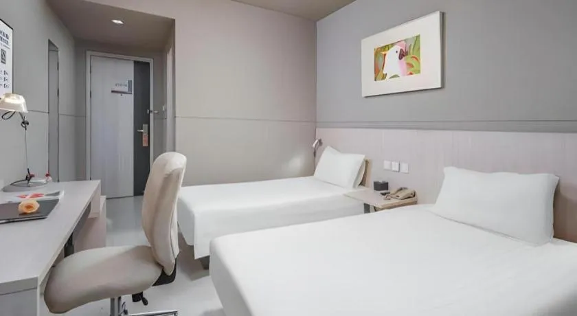 Bed in Jinjiang Inn Changzhou Global Dinosaur City Olympic Center