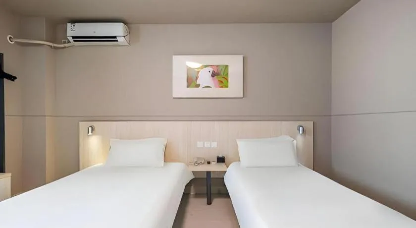 Bed in Jinjiang Inn Changzhou Global Dinosaur City Olympic Center