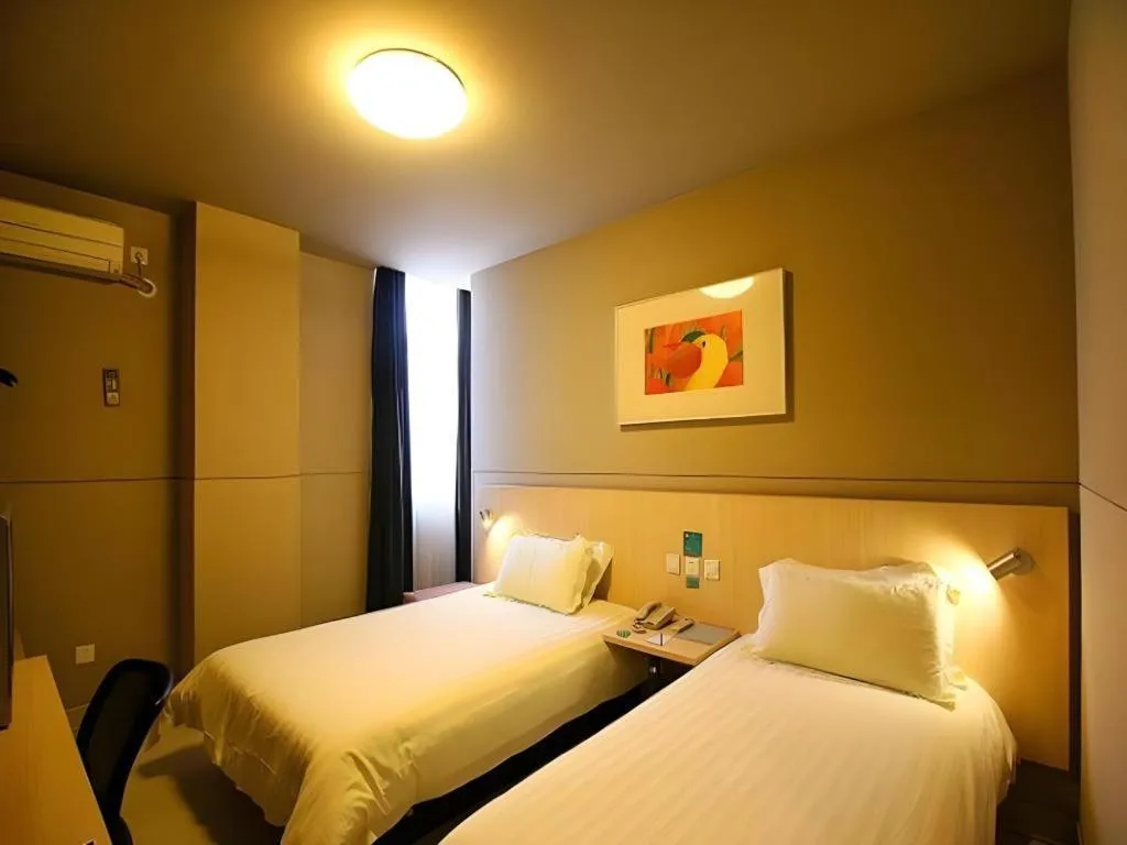 Bed in Jinjiang Inn Changzhou Global Dinosaur City Olympic Center