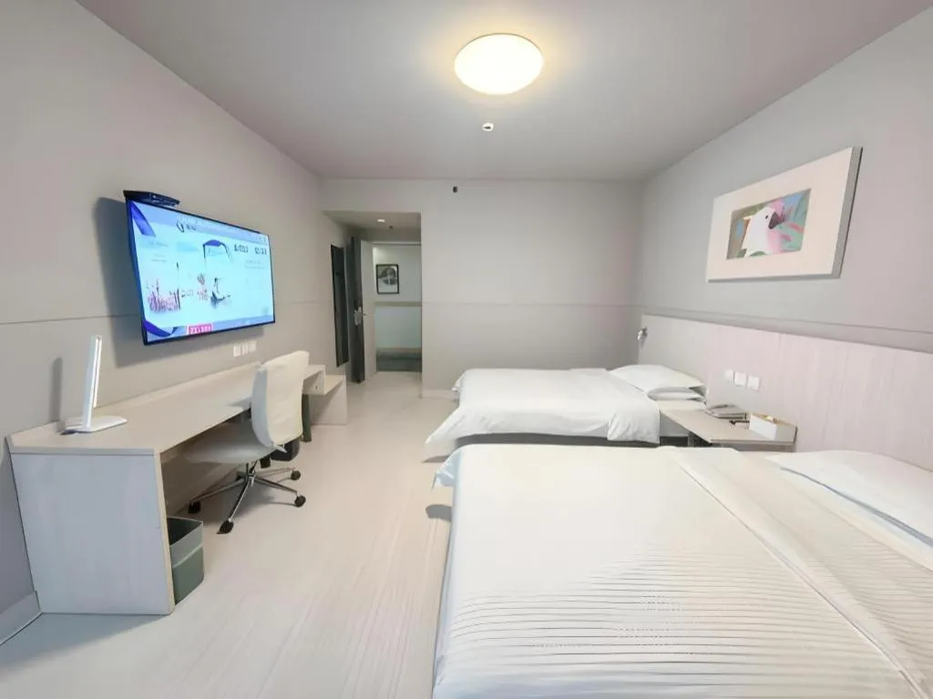 Bed in Jinjiang Inn Changzhou Global Dinosaur City Olympic Center