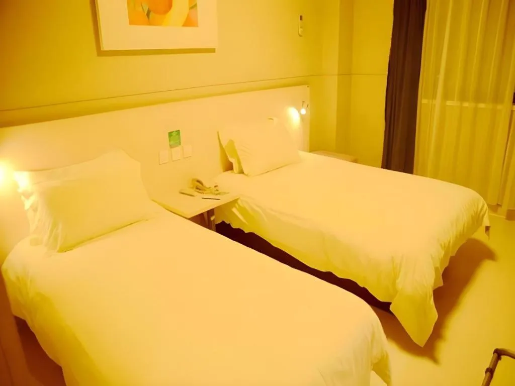 Bed in Jinjiang Inn Changzhou Global Dinosaur City Olympic Center