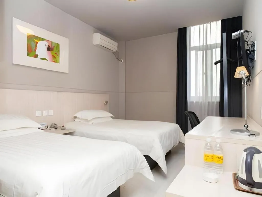 Bed in Jinjiang Inn Changzhou Global Dinosaur City Olympic Center