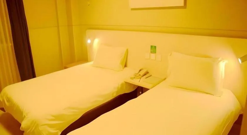 Bed in Jinjiang Inn Changzhou Global Dinosaur City Olympic Center