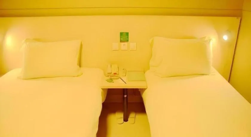 Bed in Jinjiang Inn Changzhou Global Dinosaur City Olympic Center