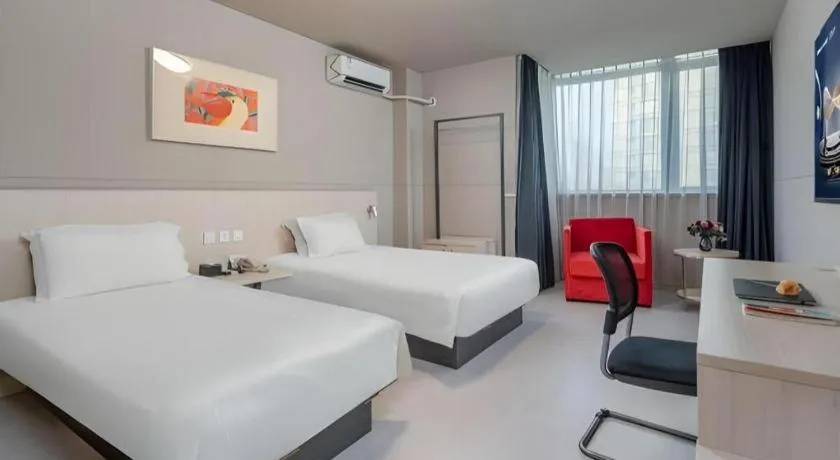 Bed in Jinjiang Inn Changzhou Global Dinosaur City Olympic Center