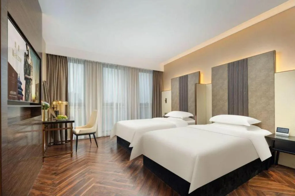 Bed in Jinjiang Metropolo Hotel - Taizhou Wanda Plaza