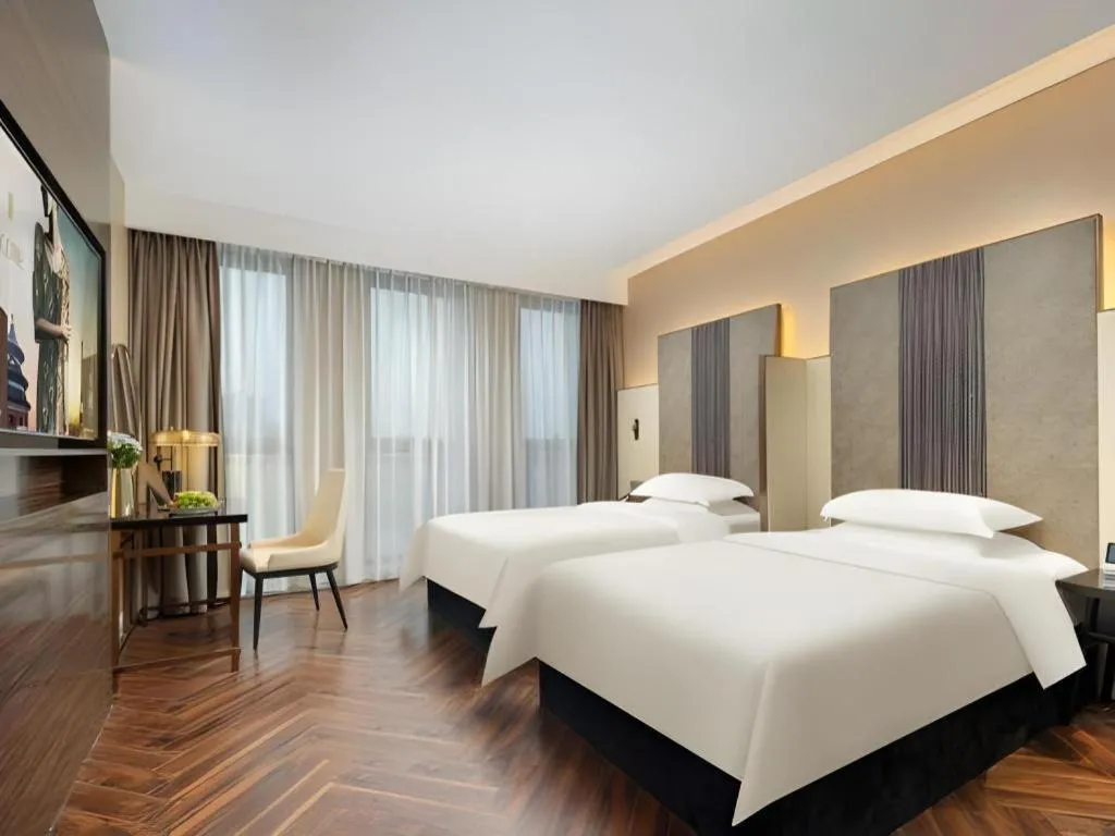 Bed in Jinjiang Metropolo Hotel - Taizhou Wanda Plaza