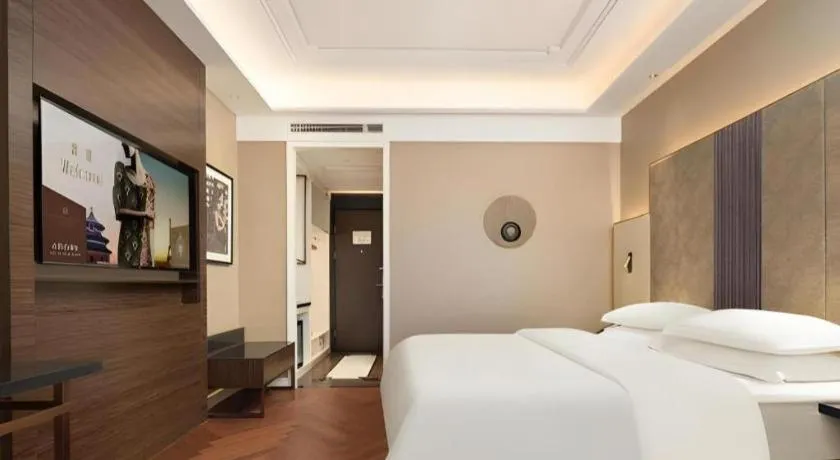 Bed in Jinjiang Metropolo Hotel - Taizhou Wanda Plaza