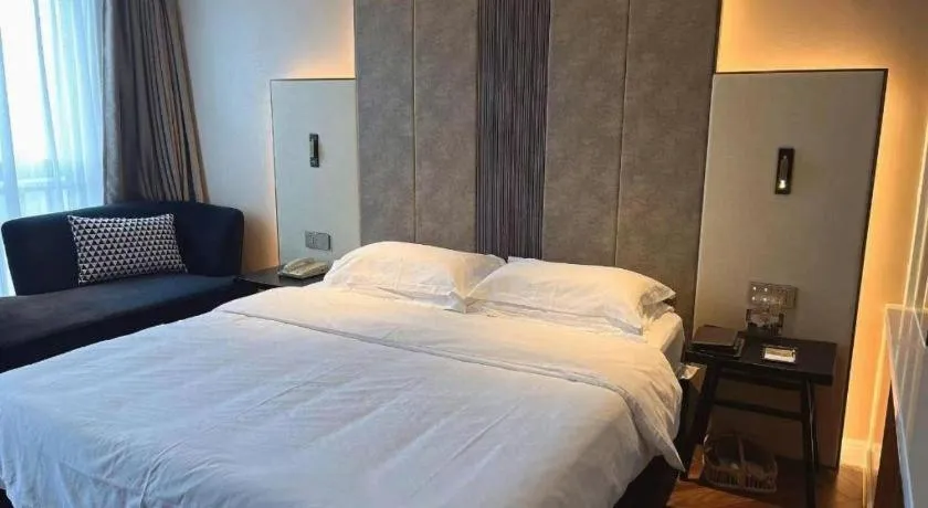 Bed in Jinjiang Metropolo Hotel - Taizhou Wanda Plaza