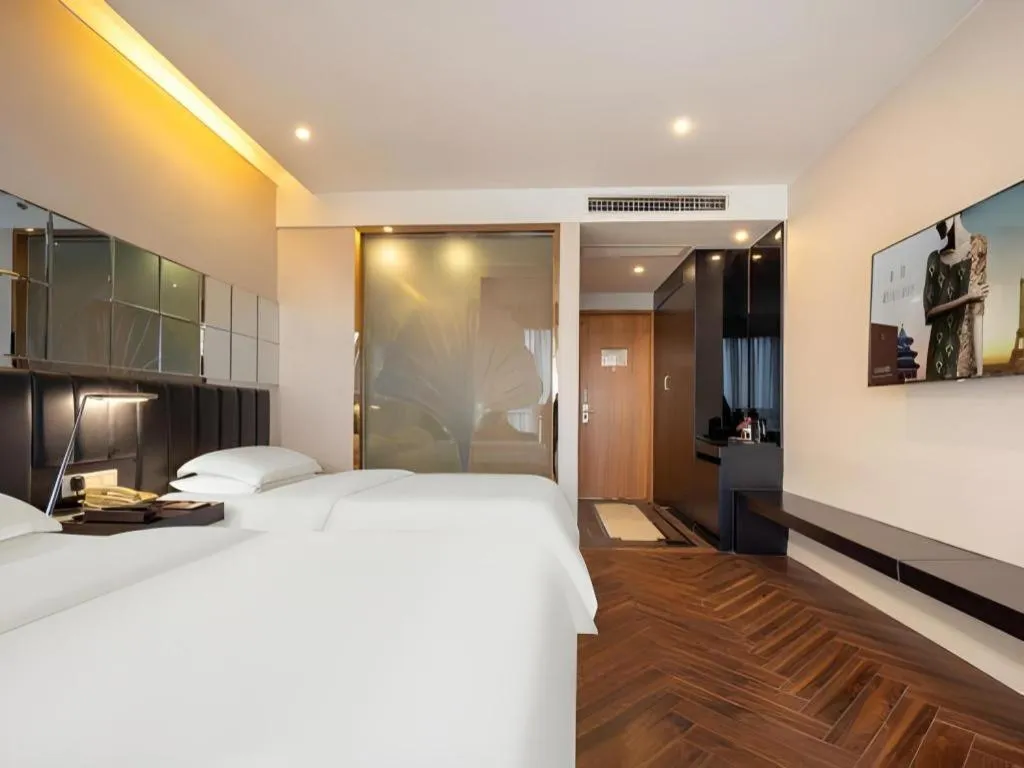 Bed in Jinjiang Metropolo Hotel - Taizhou Wanda Plaza