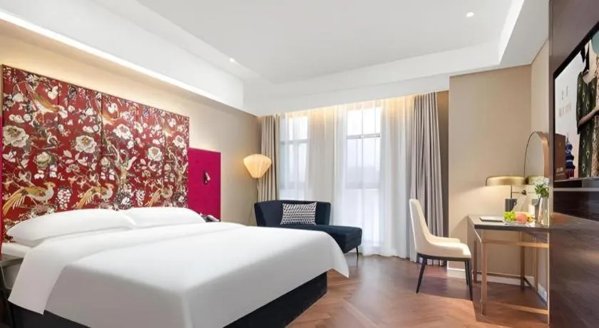 Bed in Jinjiang Metropolo Hotel - Taizhou Wanda Plaza