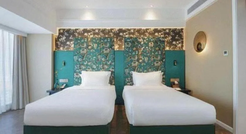 Bed in Jinjiang Metropolo Hotel - Taizhou Wanda Plaza