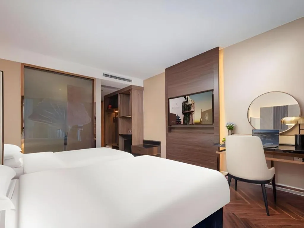 Bed in Jinjiang Metropolo Hotel - Taizhou Wanda Plaza