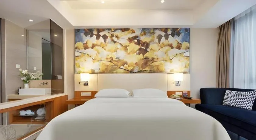 Bed in Jinjiang Metropolo Hotel - Taizhou Wanda Plaza