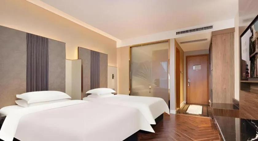 Bed in Jinjiang Metropolo Hotel - Taizhou Wanda Plaza
