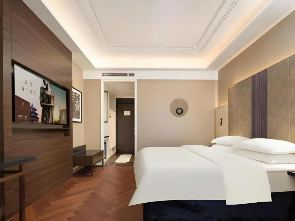 Bed in Jinjiang Metropolo Hotel - Taizhou Wanda Plaza