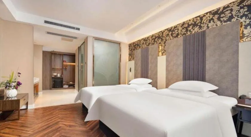 Bed in Jinjiang Metropolo Hotel - Taizhou Wanda Plaza