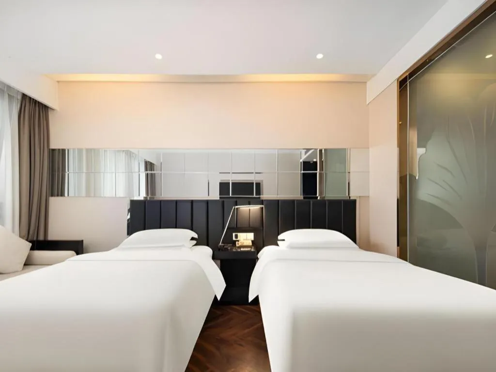 Bed in Jinjiang Metropolo Hotel - Taizhou Wanda Plaza