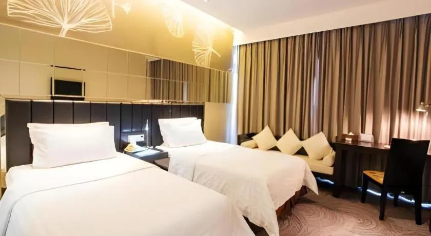 Bed in Jinjiang Metropolo Hotel - Taizhou Wanda Plaza