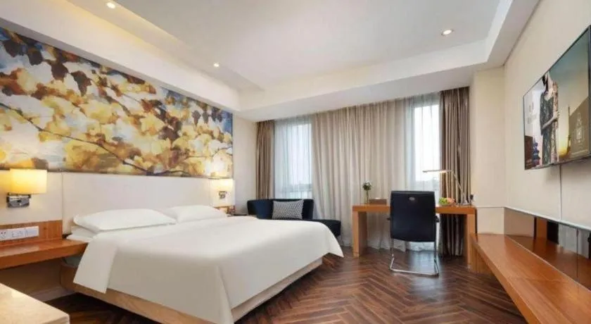 Bed in Jinjiang Metropolo Hotel - Taizhou Wanda Plaza