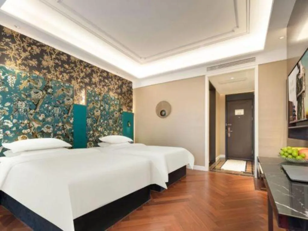 Bed in Jinjiang Metropolo Hotel - Taizhou Wanda Plaza