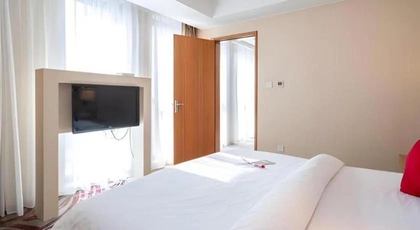 Bed in Jinjiang Metropolo Hotel - Taizhou Wanda Plaza