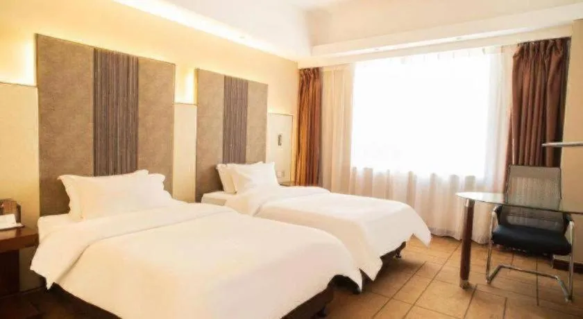 Bed in Metropolo Hotel Shijiazhuang Yuhua Wanda Plaza