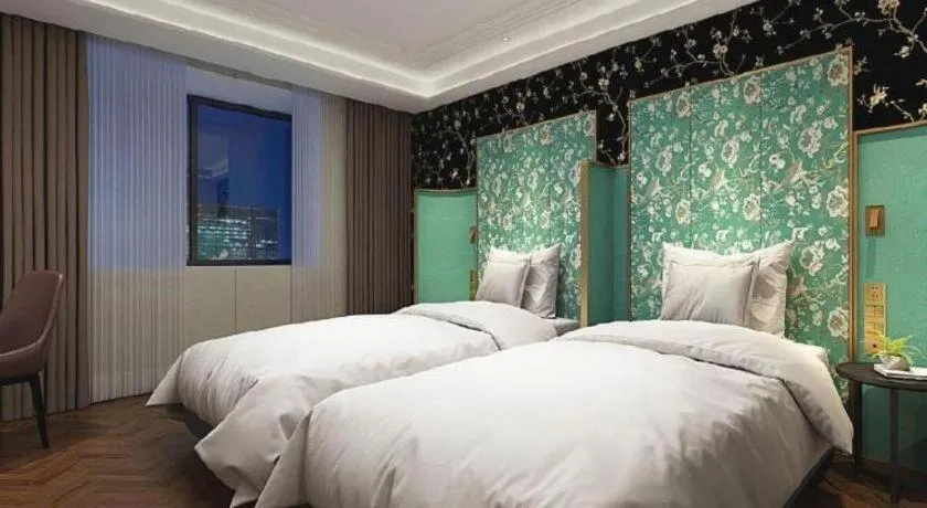 Bed in Metropolo Hotel Shijiazhuang Yuhua Wanda Plaza