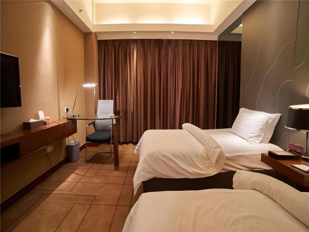 Bed in Metropolo Hotel Shijiazhuang Yuhua Wanda Plaza