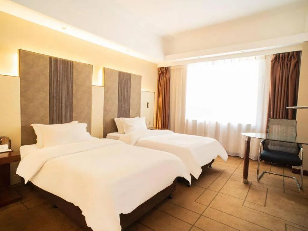 Bed in Metropolo Hotel Shijiazhuang Yuhua Wanda Plaza