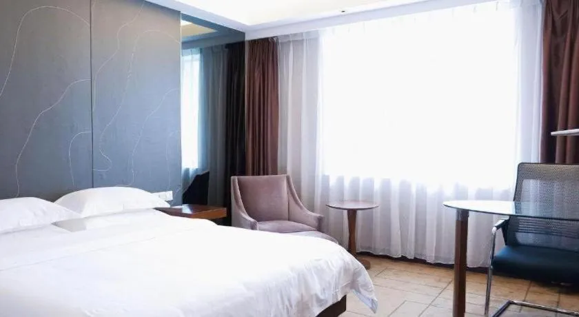 Bed in Metropolo Hotel Shijiazhuang Yuhua Wanda Plaza