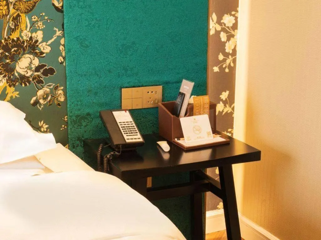 Bed in Metropolo Hotel Shijiazhuang Yuhua Wanda Plaza