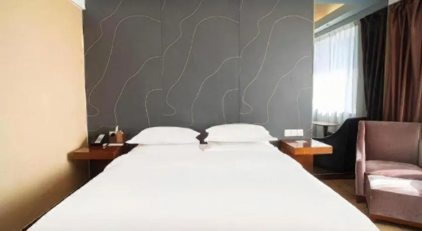 Bed in Metropolo Hotel Shijiazhuang Yuhua Wanda Plaza
