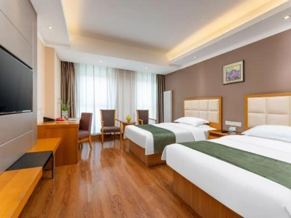 Bed in GreenTree Inn Shandong Taian Feicheng Xincheng Road Business Hotel