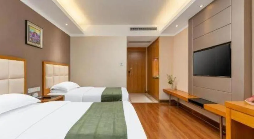 Bed in GreenTree Inn Shandong Taian Feicheng Xincheng Road Business Hotel