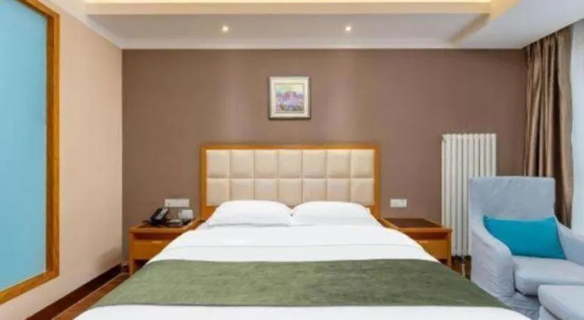 Bed in GreenTree Inn Shandong Taian Feicheng Xincheng Road Business Hotel