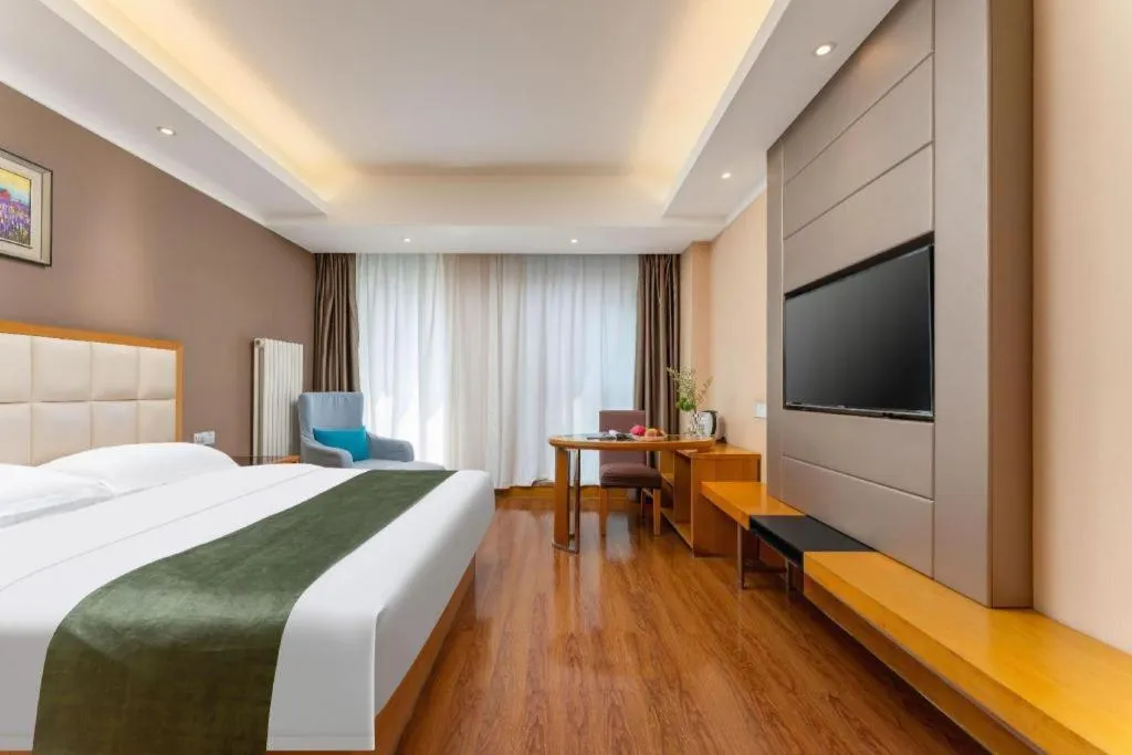 Bed in GreenTree Inn Shandong Taian Feicheng Xincheng Road Business Hotel