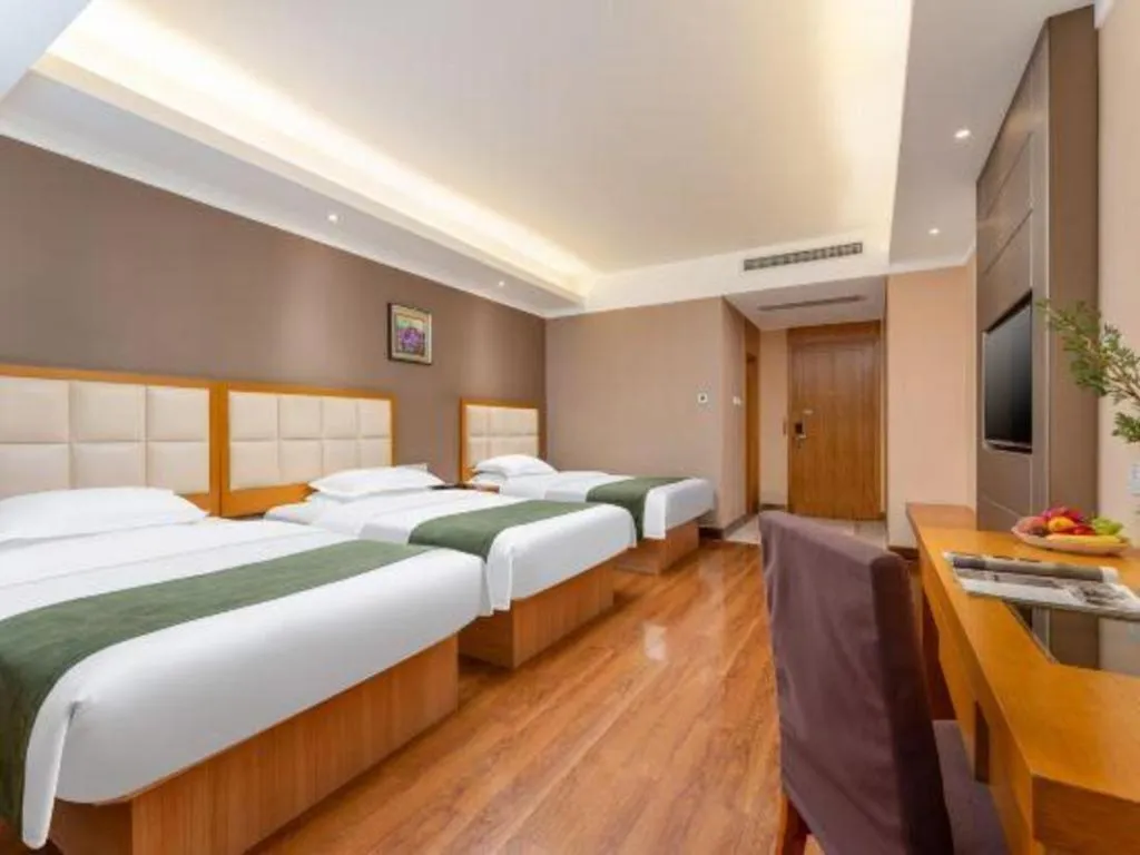 Bed in GreenTree Inn Shandong Taian Feicheng Xincheng Road Business Hotel